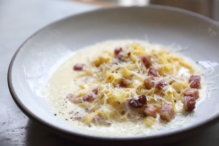 fettuccine carbonara , fettuccine pasta spaghetti with bacon ham and mushroon in white sauce italian foodの写真素材