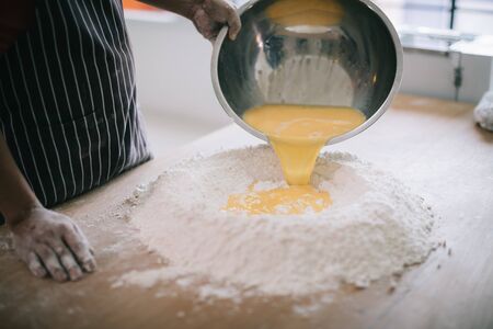 Making Handmade Noodles on wood backgroundの写真素材