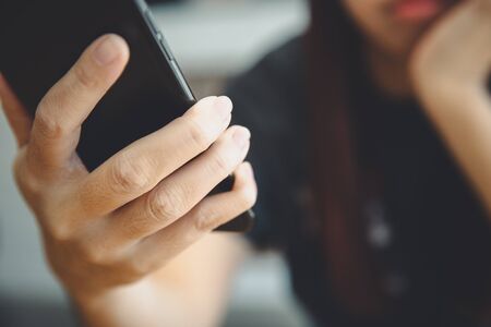 Woman hand using smart phone in lifestyle