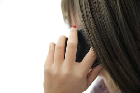 Woman hand calling with smartphone in business