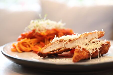 Spaghetti bolognese tomato sauce with fried chicken ,の写真素材