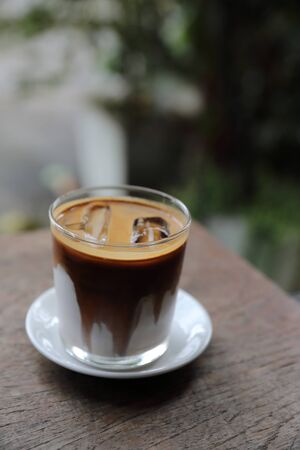ice latte coffe on wood in coffee shopの写真素材