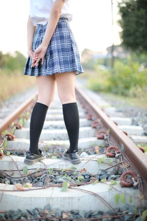 Asian school girl walking in urban cityの写真素材