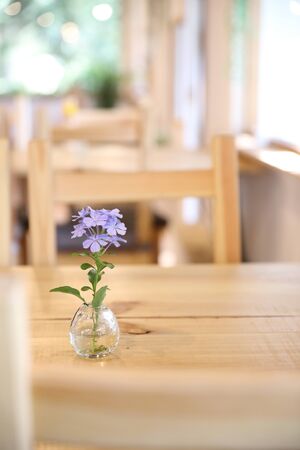 purple flower in jar on wood background in japanese restuarantの写真素材