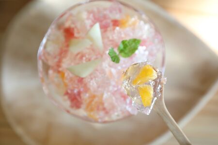 Japanese dessert jelly with fruit on wood plate