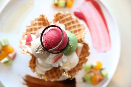 ice cream on waffle and fruit topping