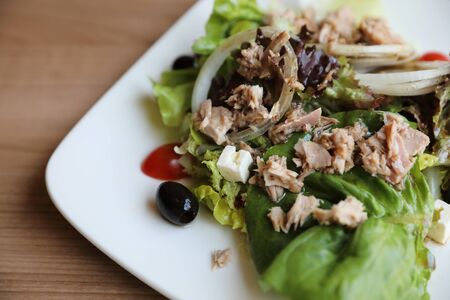 Tuna salad appetizer on wood backgroundの写真素材
