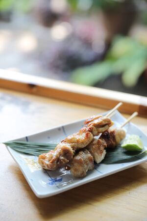 japanese food , Chicken yakitori on wood backgroundの写真素材