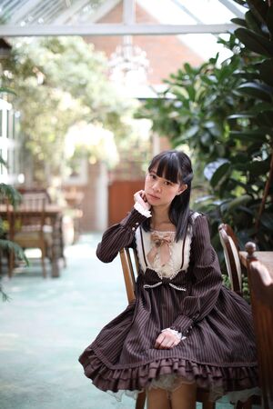 Portrait asian girl with purple flowers backgroundの写真素材