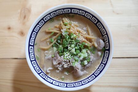 Ramen Japanese noodle soup food with noodle and pork on wooden tableの写真素材