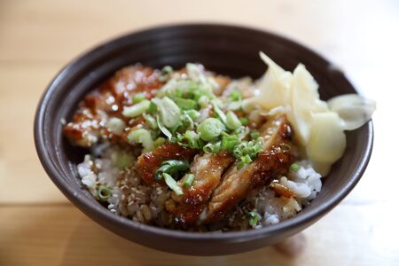 japanese food , Chicken teriyoki with rice on wood backgroundの写真素材