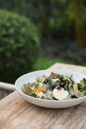 caesar salad appetizer on wooden backgroundの写真素材