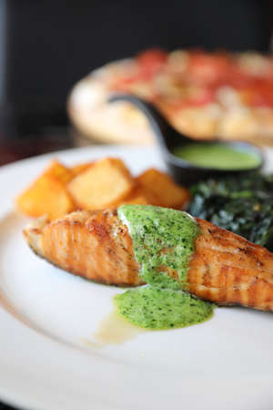 Salmon steak with pesto sauceの写真素材