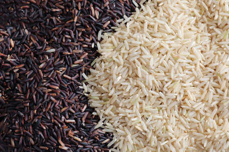 Organic raw brown rice and riceberry rice in close upの写真素材