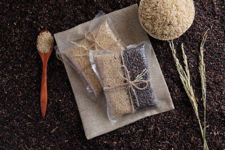 Organic raw brown rice and riceberry rice in close upの写真素材