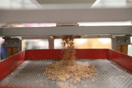 Factory machine Milling rice in close upの写真素材