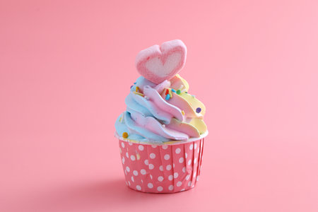colorful cupcake isolated in pink backgroundの写真素材