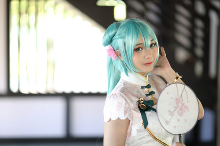 Japan anime cosplay portrait of a girl with chinese dress costume in chinese gardenの写真素材