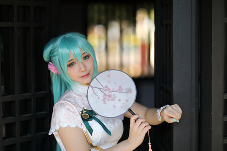 Japan anime cosplay portrait of a girl with chinese dress costume in chinese gardenの写真素材