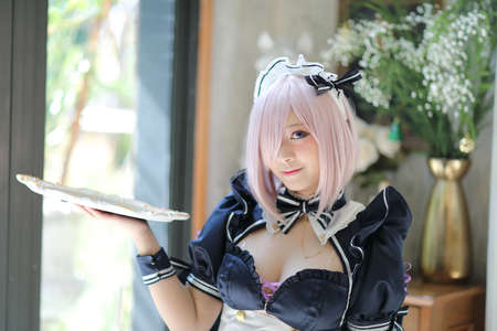 Japan anime cosplay portrait of girl with comic maid costumeの写真素材