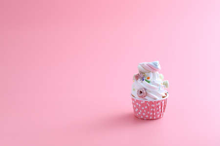 cupcake isolated in pink backgroundの写真素材