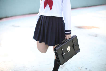 Asian school girl with japanese school bagの写真素材