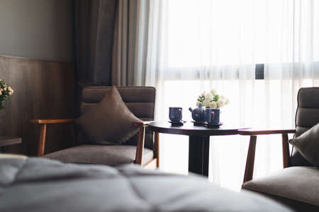 Wooden black and grey modern table and chair in bedroomの写真素材