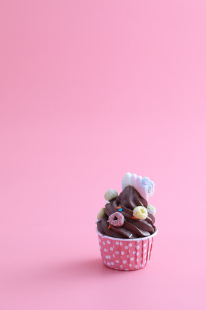 Chocolate cupcake isolated in pink backgroundの写真素材