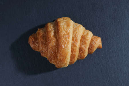 Croissant isolated in sunny light