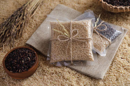 Organic raw brown rice and riceberry rice in close up