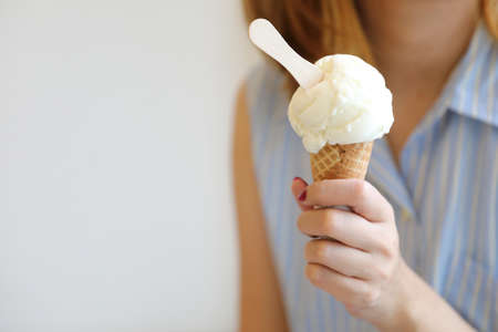 Woman hand with ice cream in close upの写真素材