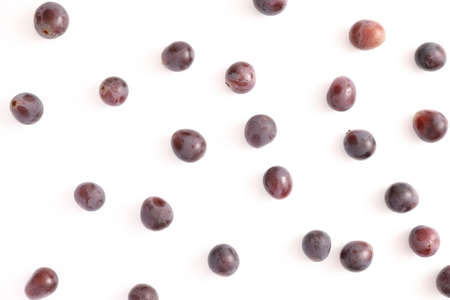 Red grapes isolated top view in white backgroundの写真素材