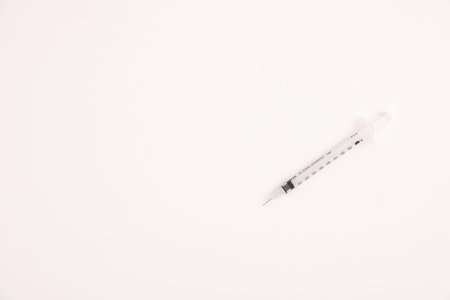 Syringe vaccine isolated in white backgroundの写真素材