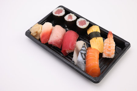 Sushi Set nigiri and sushi rolls with soy sauce and chopsticks Japanese food isolated in white backgroundの写真素材