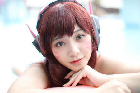 Portrait of Japan anime cosplay girl with swim suit at swimming poolの写真素材