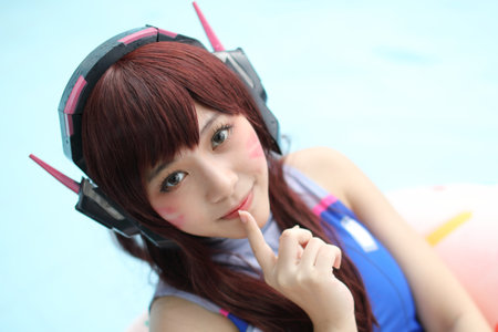 Portrait of Japan anime cosplay girl with swim suit at swimming pool