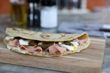 Italian cuisine , Piadina with Italian ham and cheeseの写真素材
