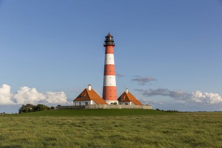 Colorful lighthouse at Westerhever, Germanyの写真素材