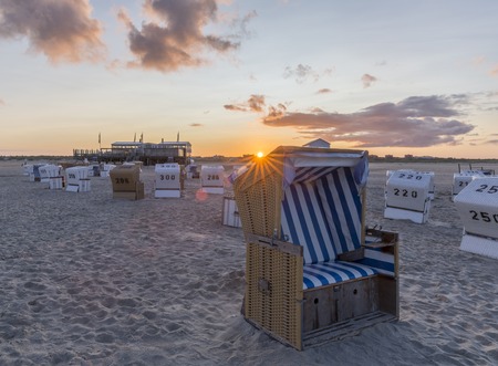 Traditional beach baskets or hooded beach chairs at nothern Germanyの写真素材