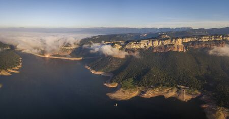 Aerial view of colorful sheer cliffs above Sau reservoir near Tavertet in Catalonia, Spainの写真素材