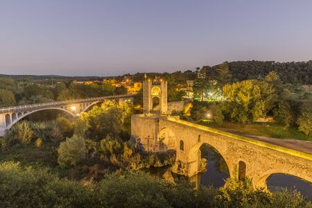The Medieval Bridge in the ancient town of Besaluの写真素材