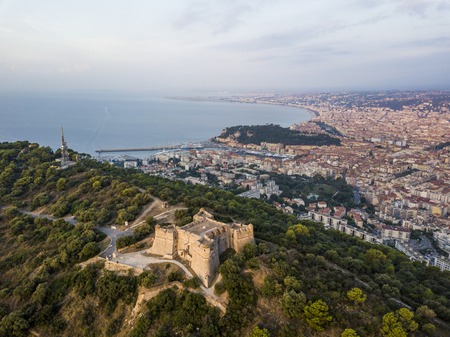 Aerial view of Fort du Mont Alban and the city of Nice at sunriseの写真素材