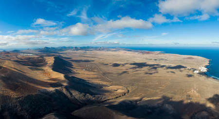 Aerial view of El Jable desert and and Famara village, Spainの写真素材