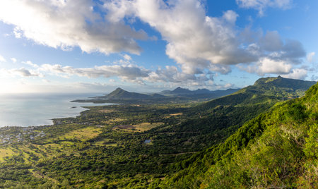Sublime Point view of mountains and coastline at sunset, Mauritiusの写真素材