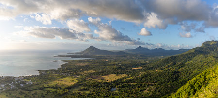 Sublime Point view of mountains and coastline at sunset, Mauritiusの写真素材