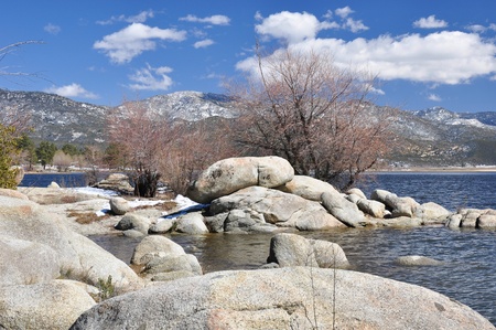 View of the rocky shoreline of Hemet Lake in Southern California.の写真素材