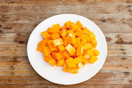 Papaya fruit in dish on Wooden tableの写真素材