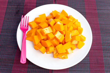 Papaya fruit in dish on Wooden tableの写真素材