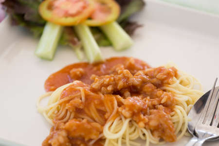 Spaghetti Bolognese on white plateの写真素材
