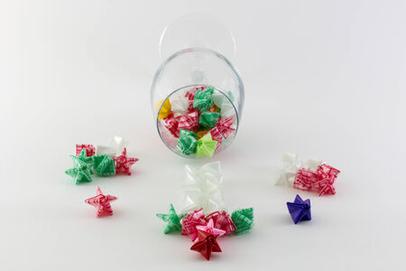 Paper stars in  glass   on white backgroundの写真素材